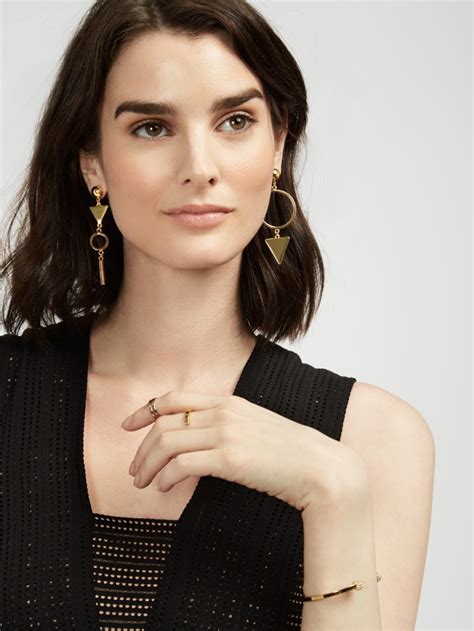 asymmetrical earrings meaning